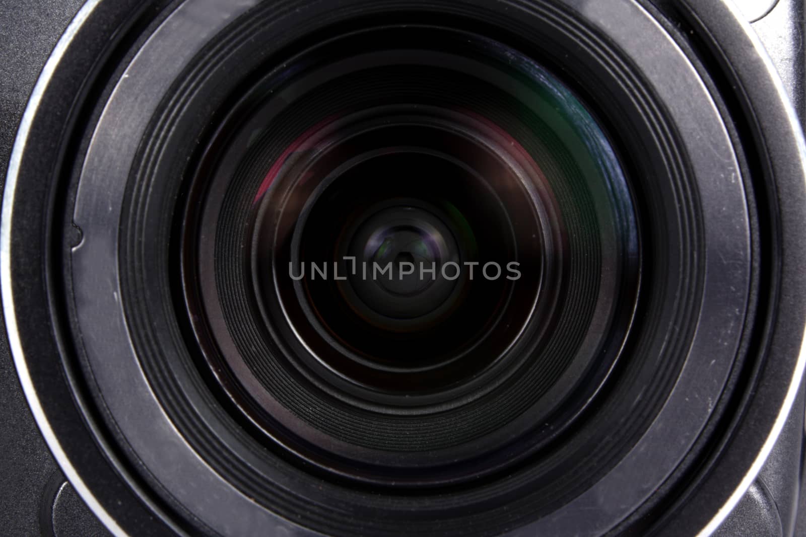 A background with a closeup view of a digital camera lens