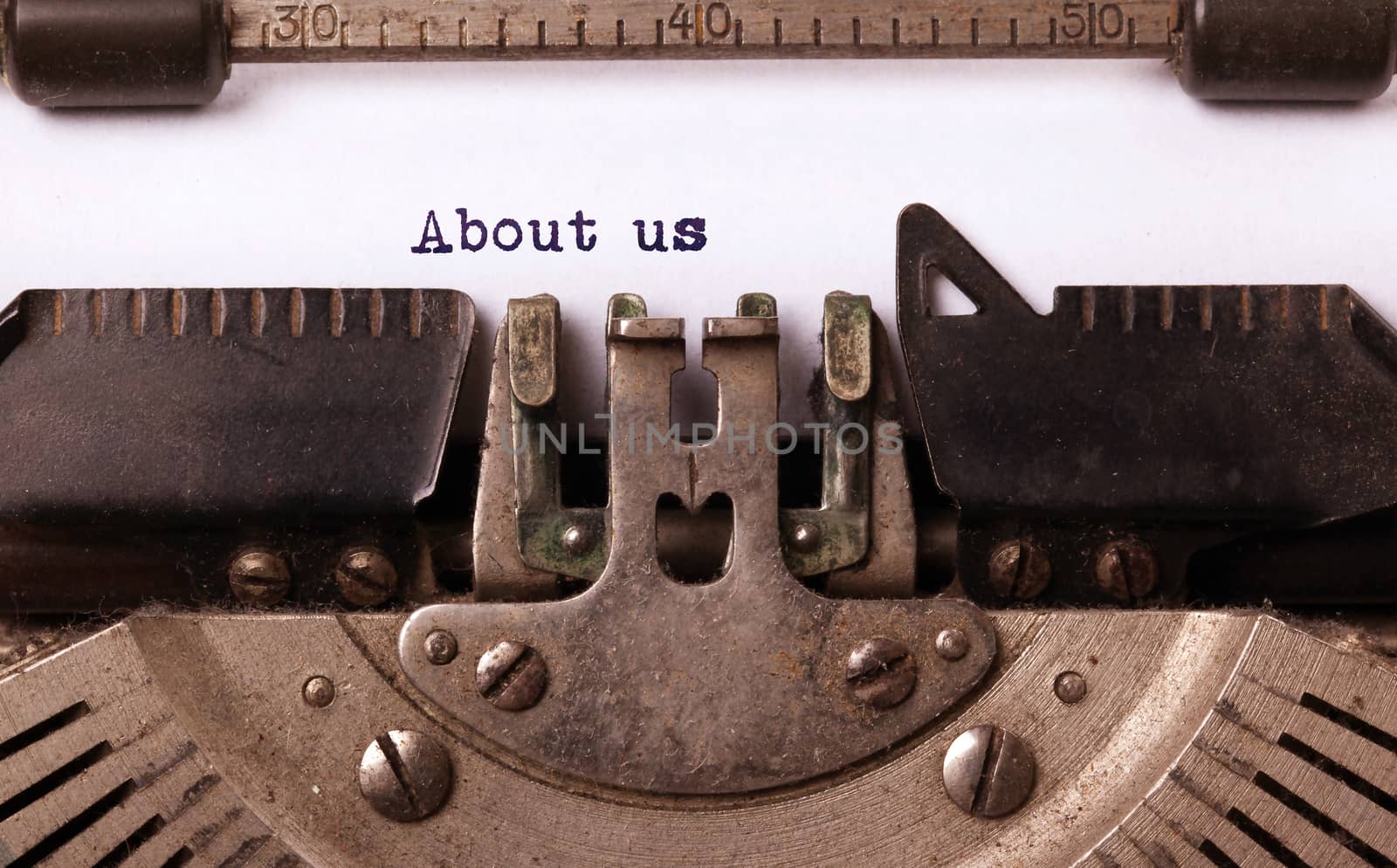 Vintage inscription made by old typewriter, about us