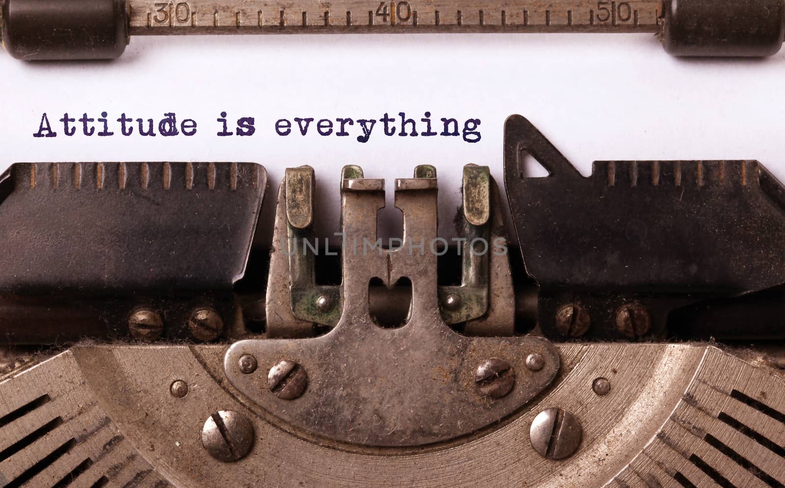 Vintage inscription made by old typewriter, attitude is everything
