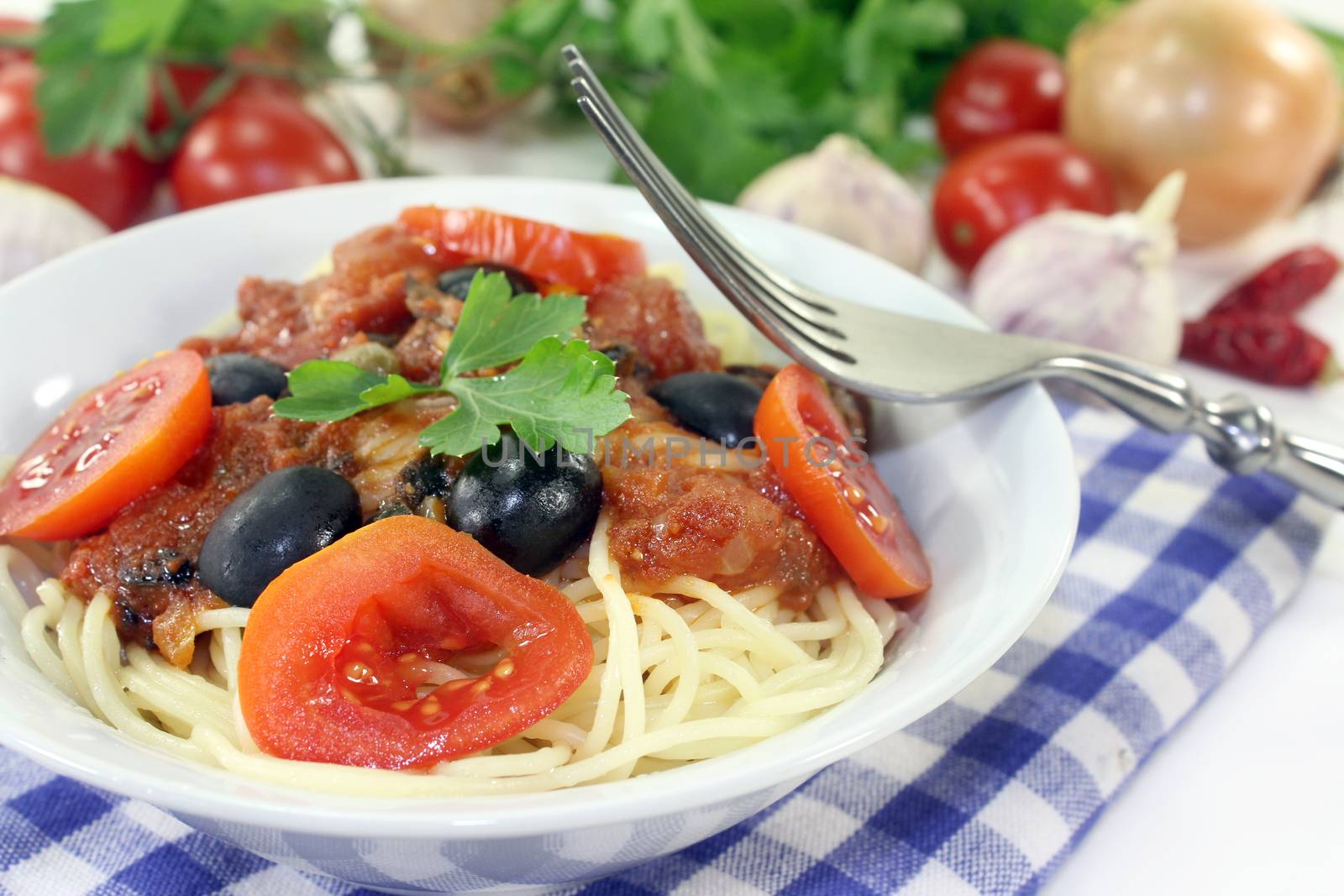 Capellini with tomatoes, anchovies, capers and olives