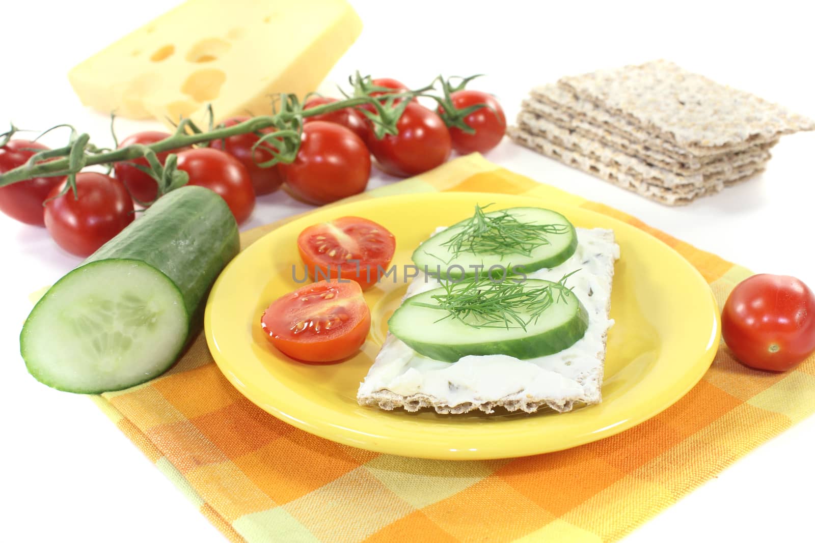 Crispbread with cream cheese on a bright background