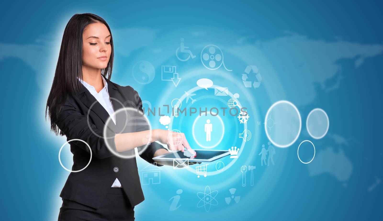 Beautiful businesswomen in suit using digital tablet. World map with circles and icons