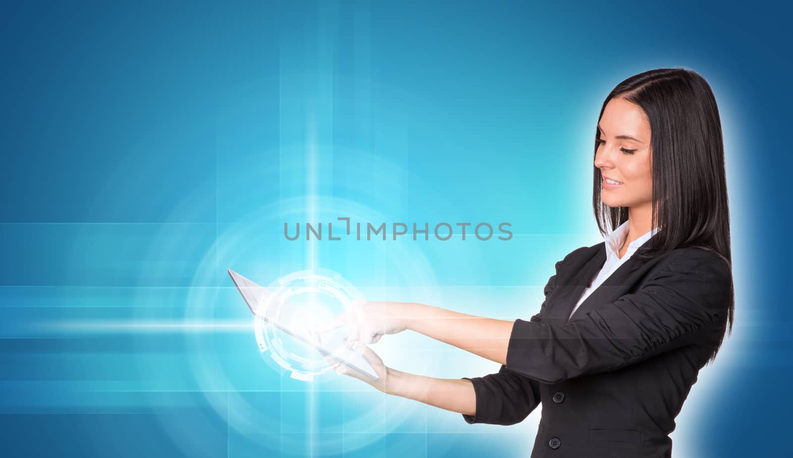 Beautiful businesswomen in suit using digital tablet by cherezoff