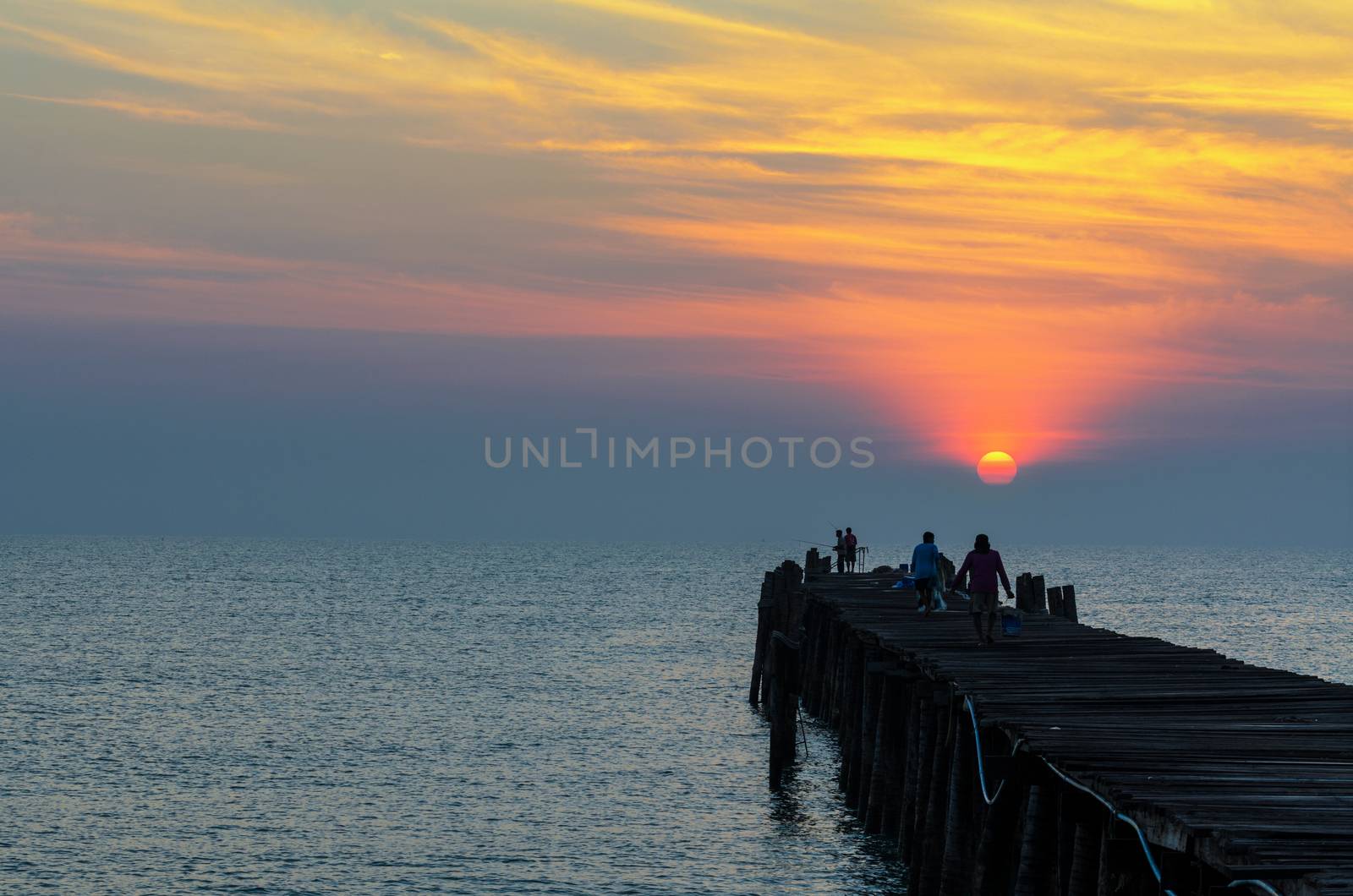 Fishing pier at sunrise by Yongkiet