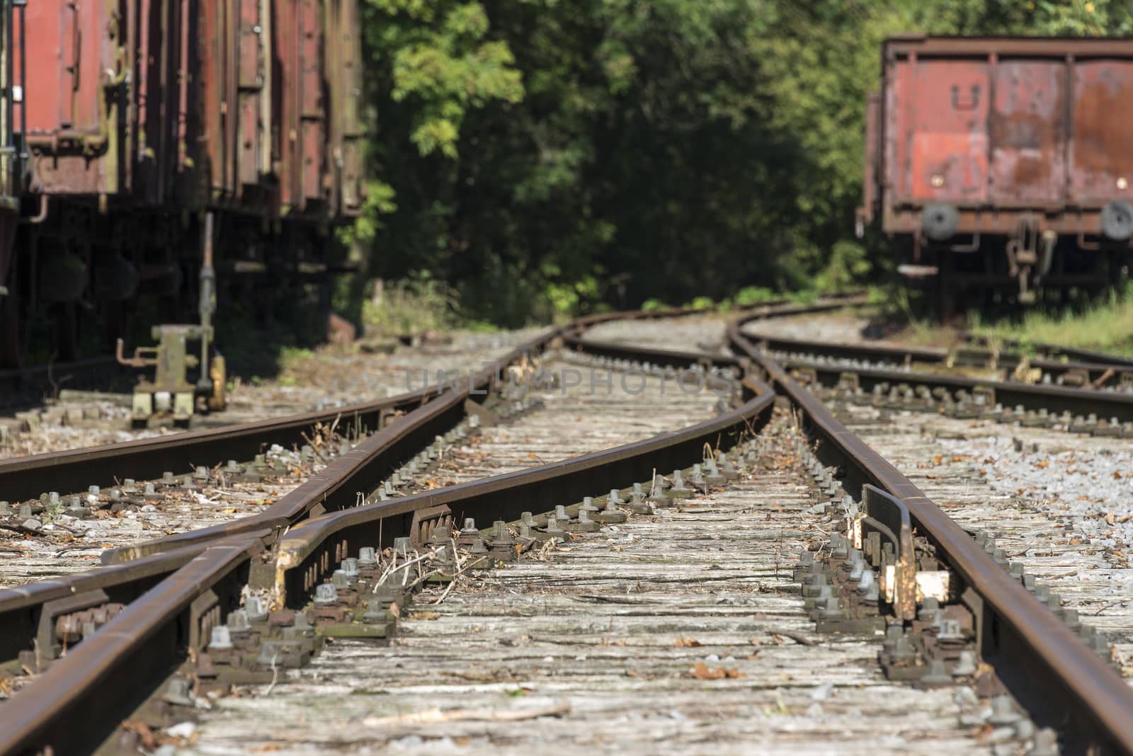 old railway shunt with wooden sleepers and old trains