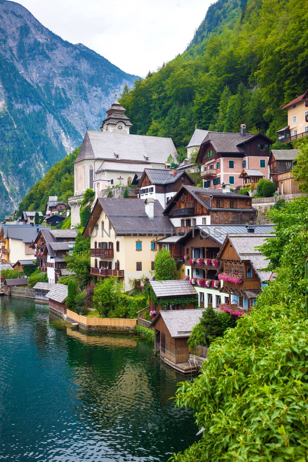 View of Hallstatt village with on lake shore and Alps behind, Austria