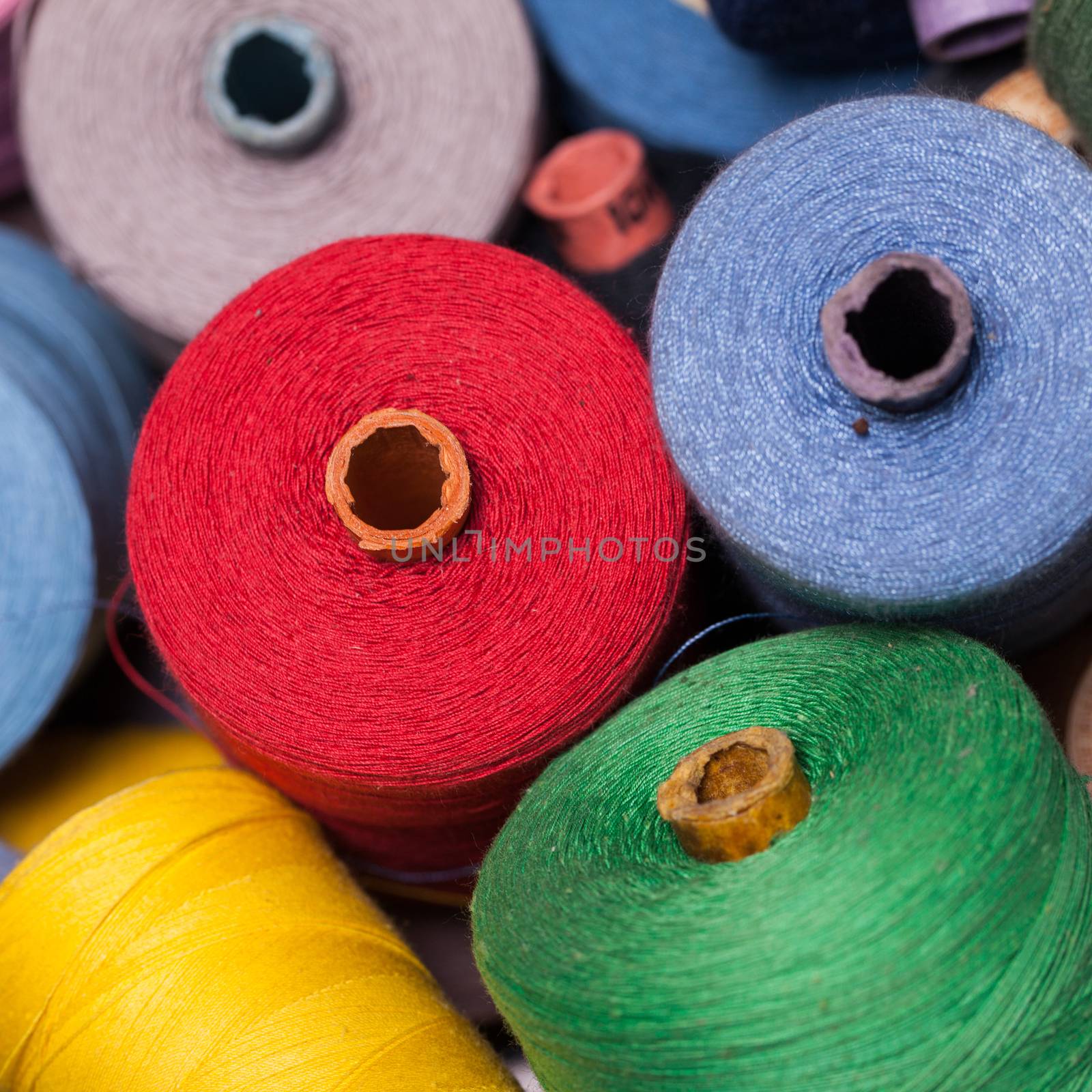 Closeup image of various colour threads by rufatjumali