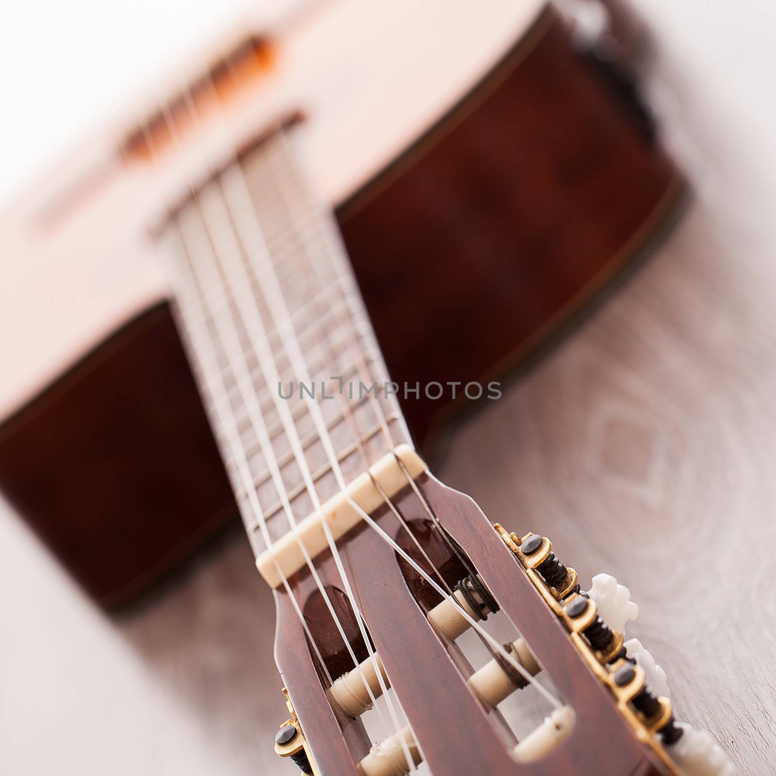 Closeup image of acoustic guitar fingerboard