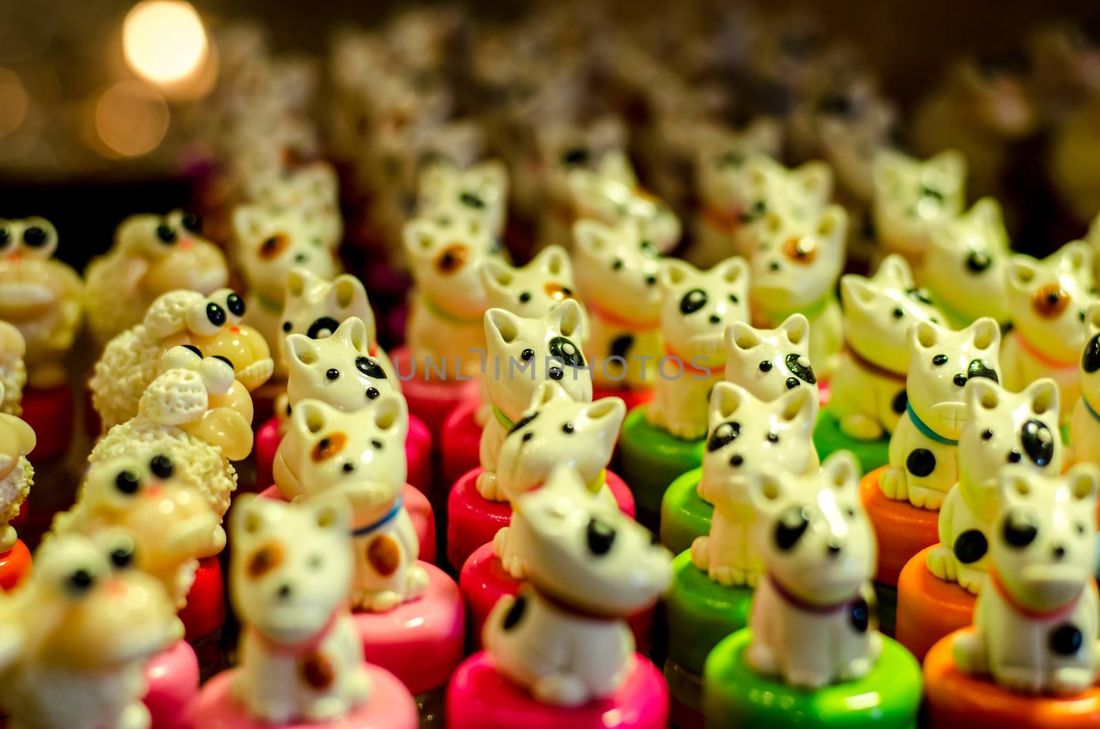 little colourful clay dogs on gray background and DOF