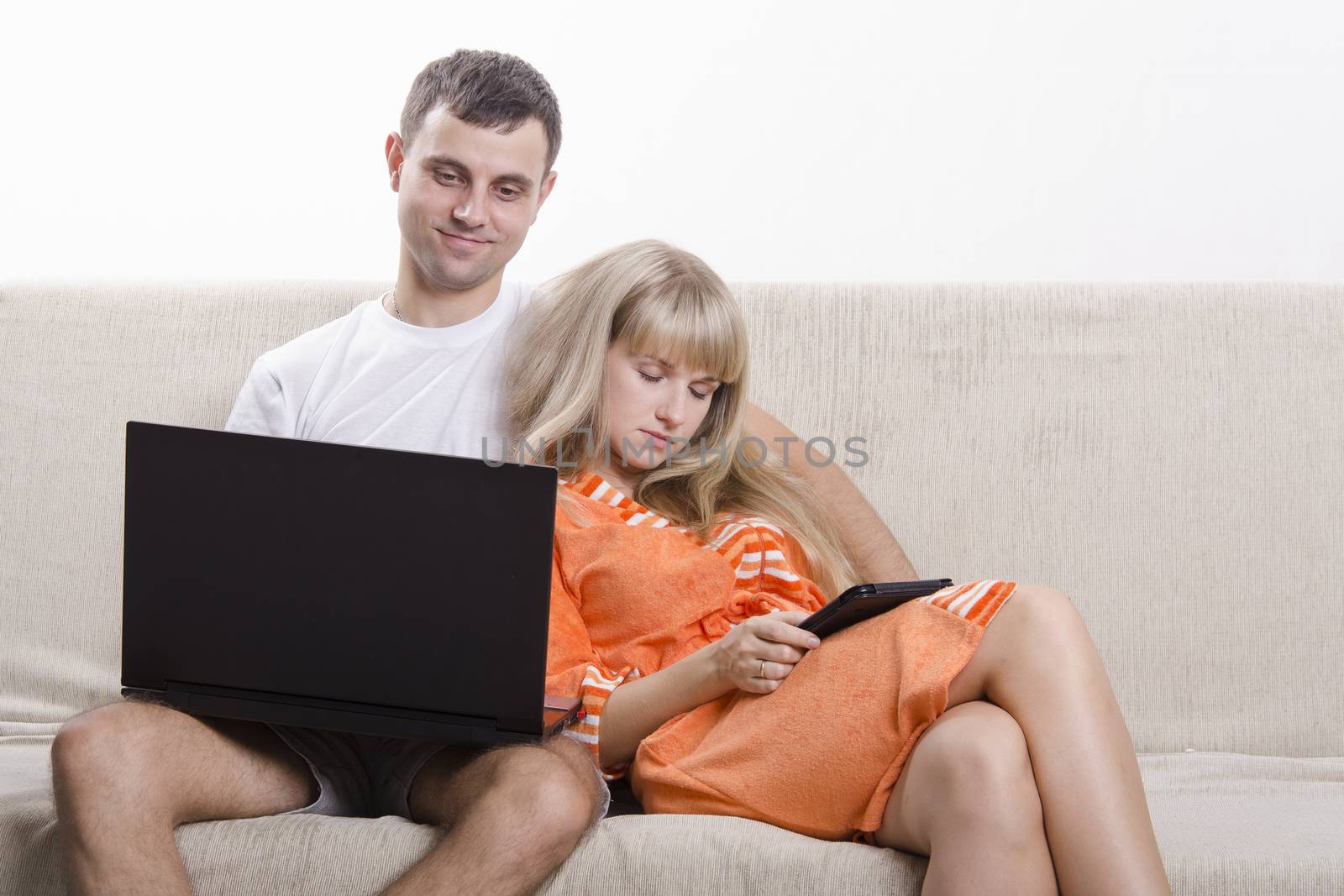 Guy and girl asleep, sitting on couch with laptop by Madhourse
