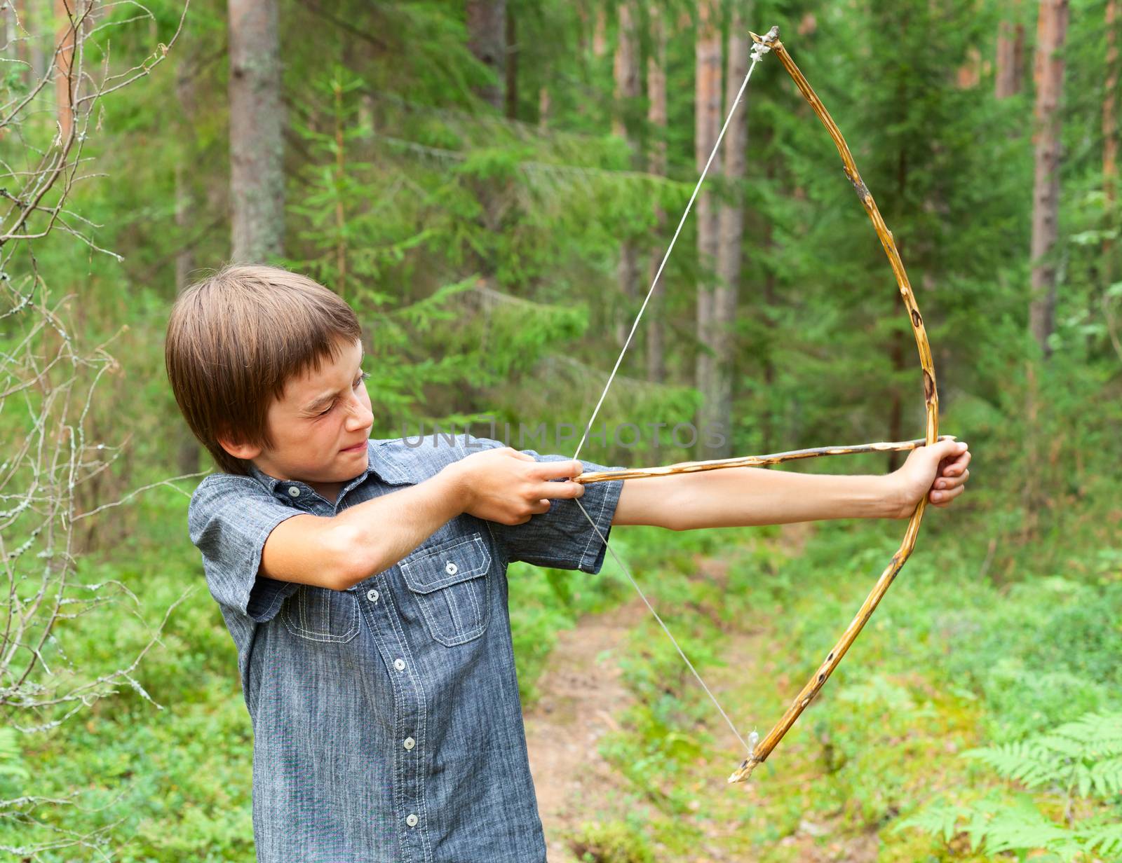 Kid with homemade bow and arrow by naumoid