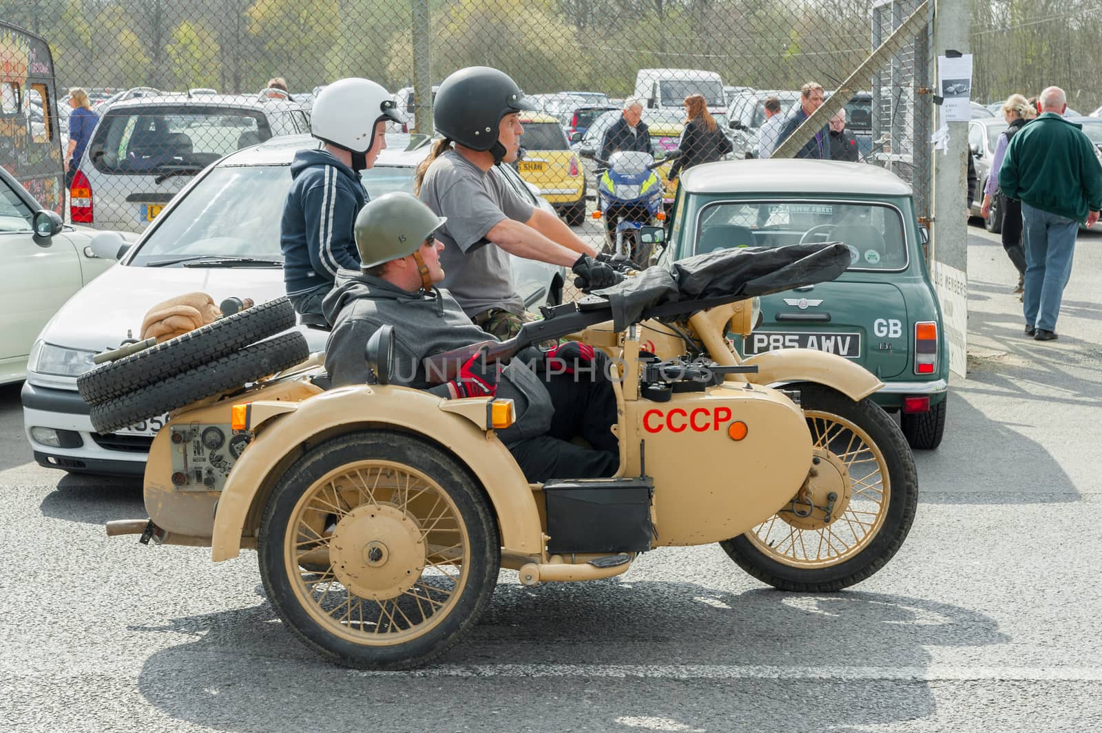 FARNBOROUGH, UK - APRIL 6, 2012: Vintage Soviet military motorcycle arriving for the annual Wheels Day auto and bike show on April 6, 2012 in Farnborough, UK.
