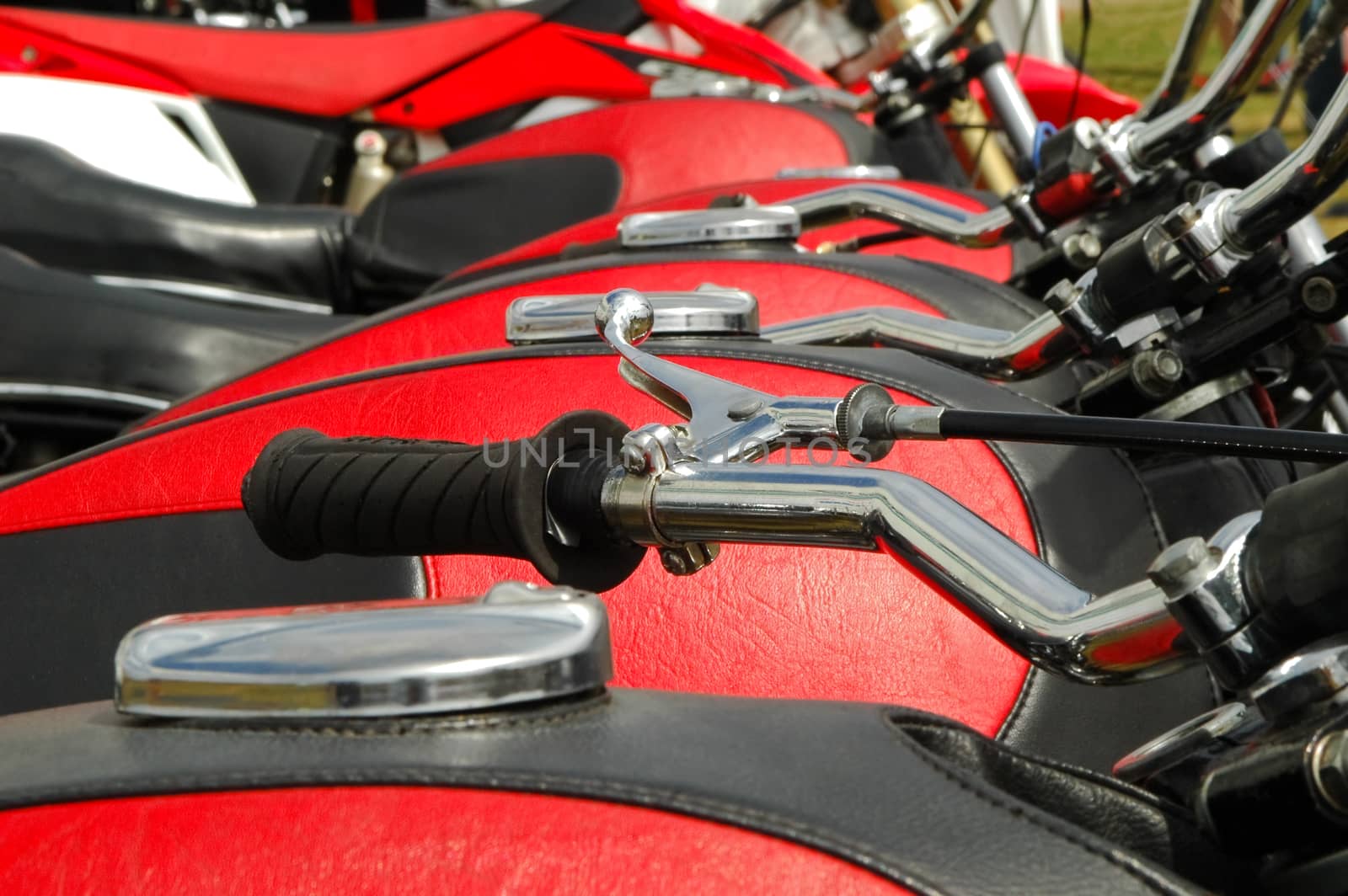 line of motorcycles with matching fuel tank covers