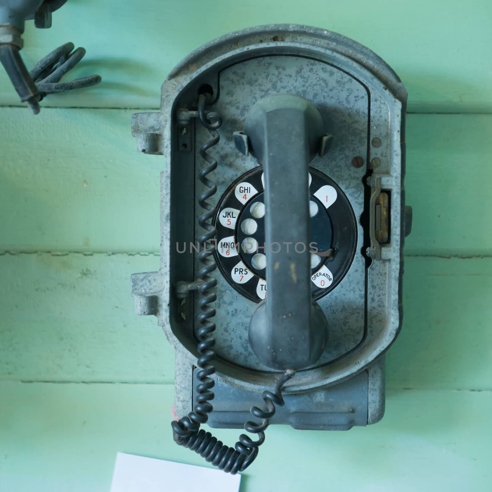 vintage telephone on the wall by witthaya