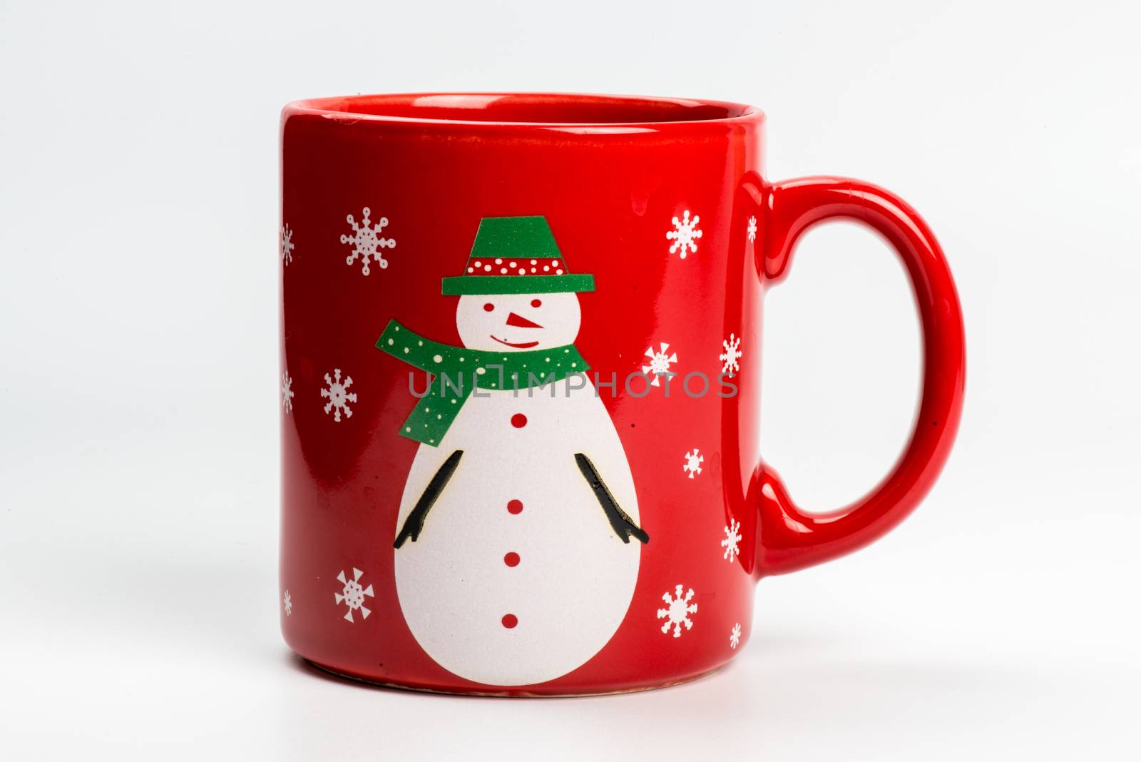 Red christmas tea mug with snowman on white background