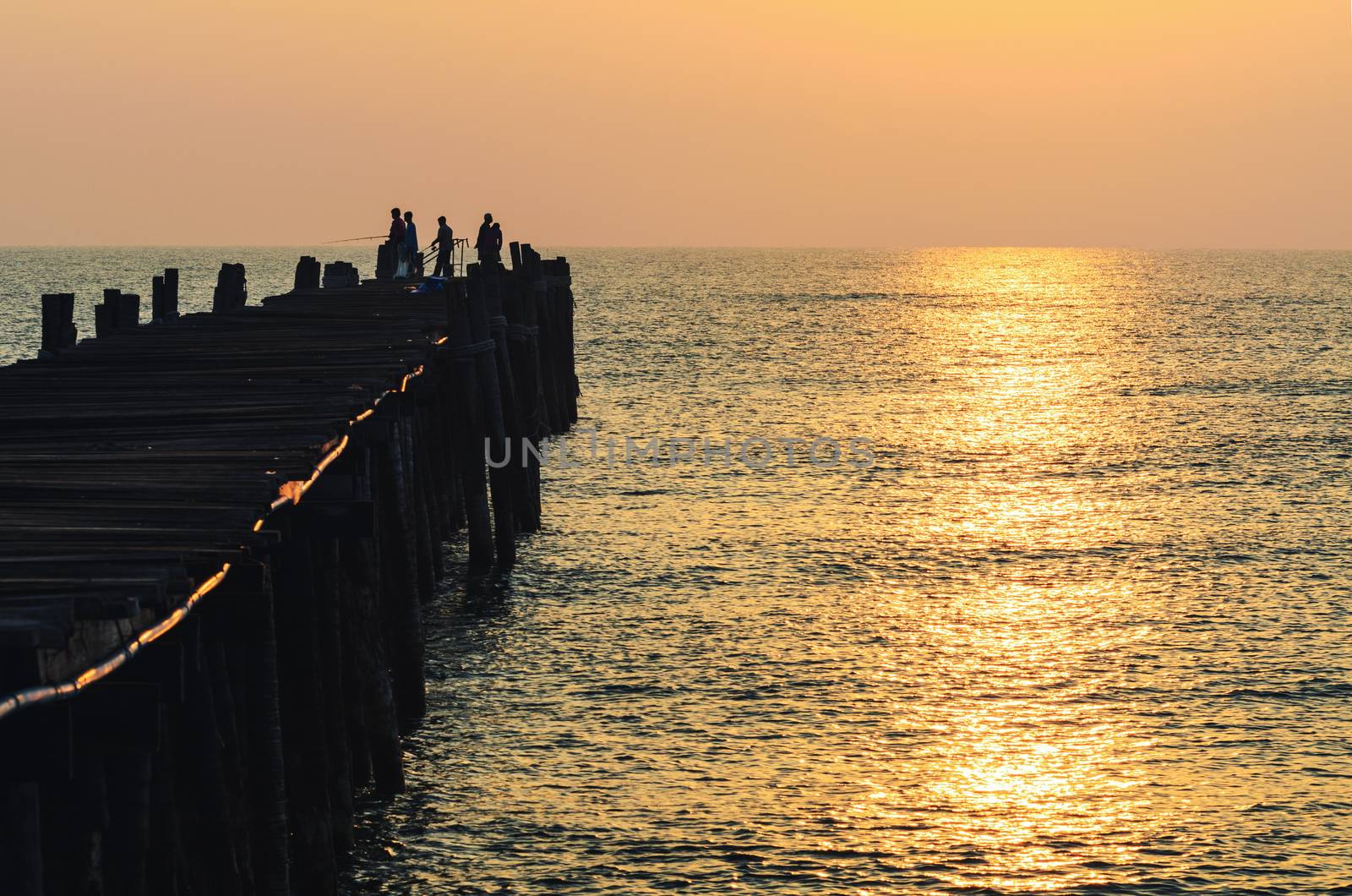 Fishing pier at sunrise by Yongkiet