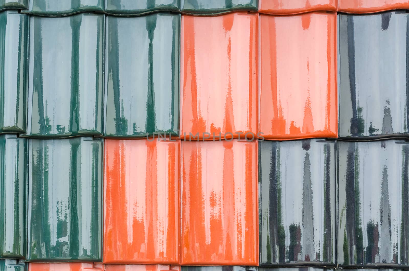 Close up of red, black roof tiles and pans, texture.