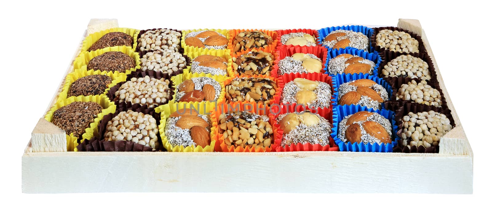 Turkish sweets, candies in a wooden box on the white background, isolated
