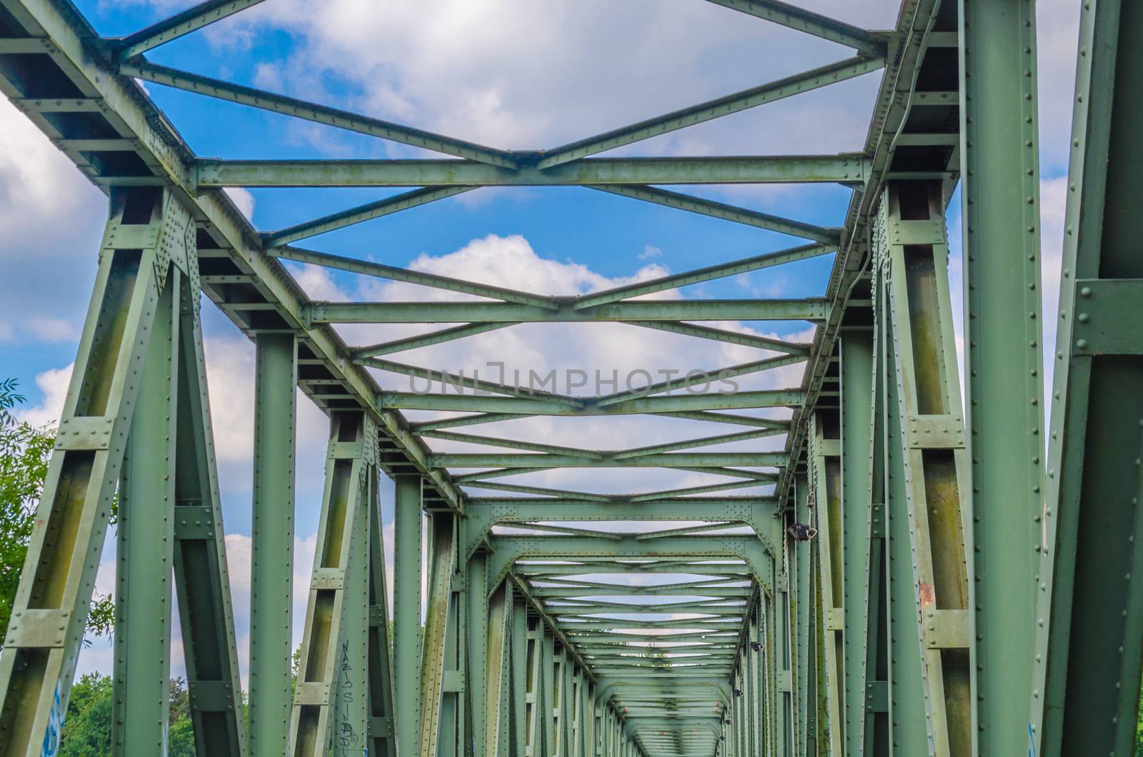 Former old riveted railway steel bridge for pedestrians and cyclists over the Ruhr in Essen Kupferdreh