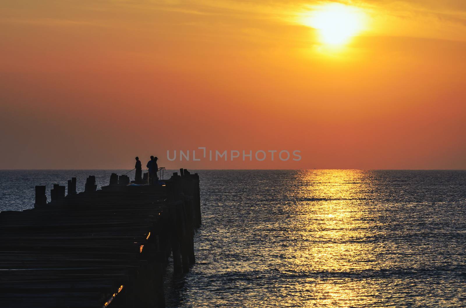 Fishing pier at sunrise by Yongkiet