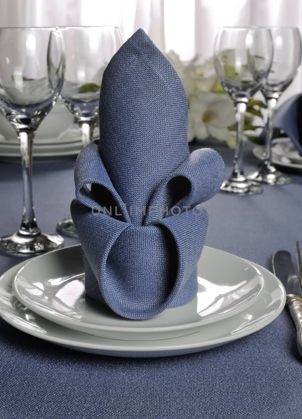 Fragment table setting decorated with flower napkin