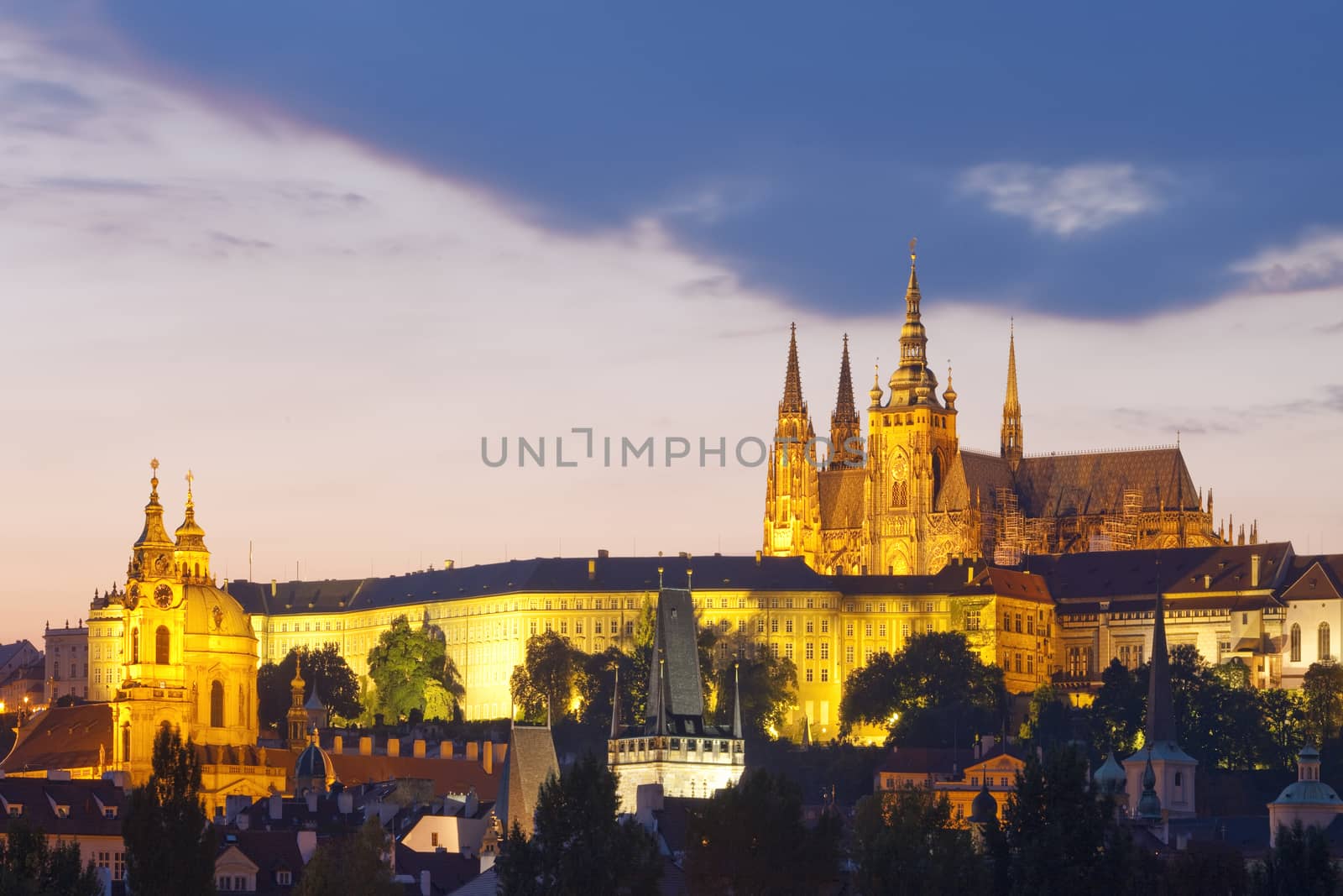 czech republic, prague - hradcany castle and st. nicolaus church at dusk