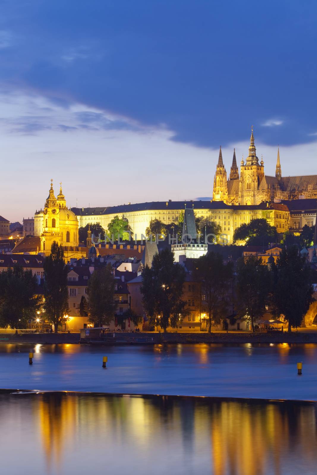 czech republic, prague - hradcany castle and st. nicolaus church at dusk