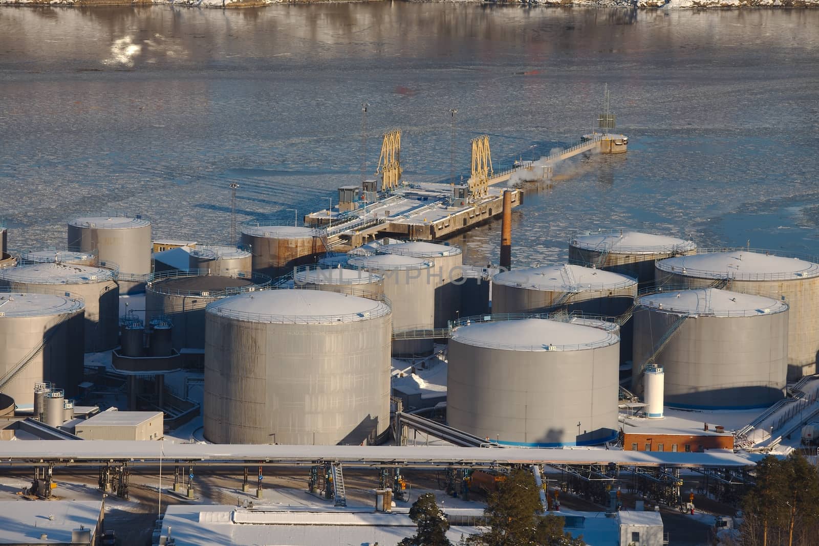 Big oil silos in a dock