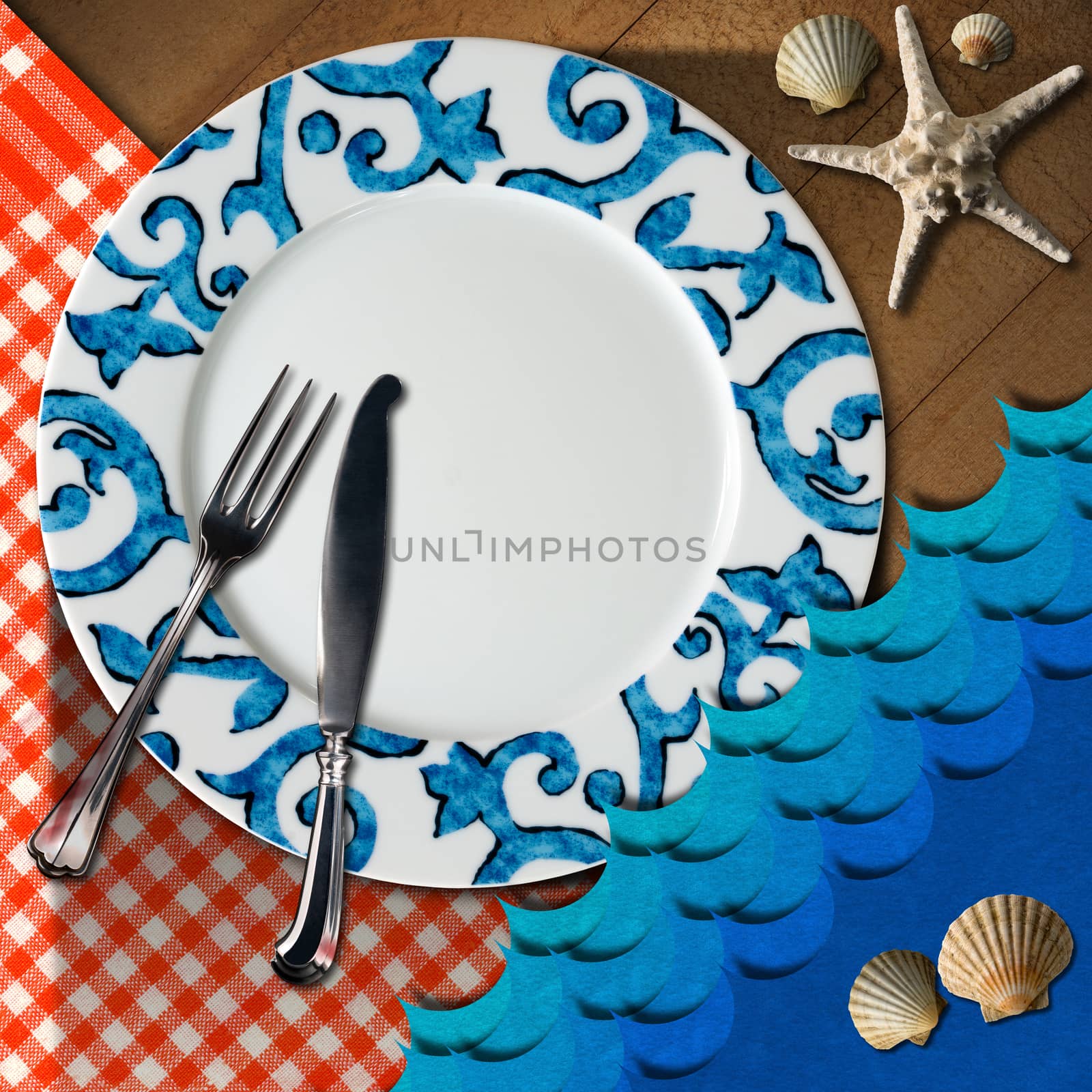 Empty plate with fork and knife, red and white checkered tablecloth, seashells, blue waves and starfish. Table set for a seafood menu
