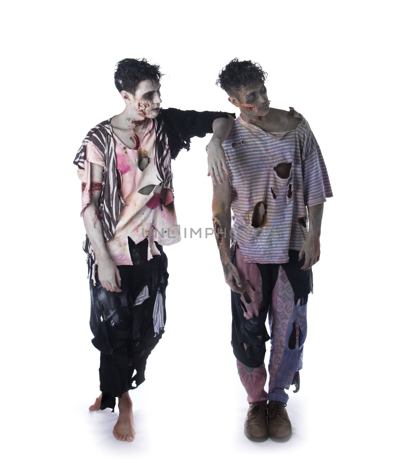 Two male zombies standing on white background, full body shot, looking away. Halloween theme