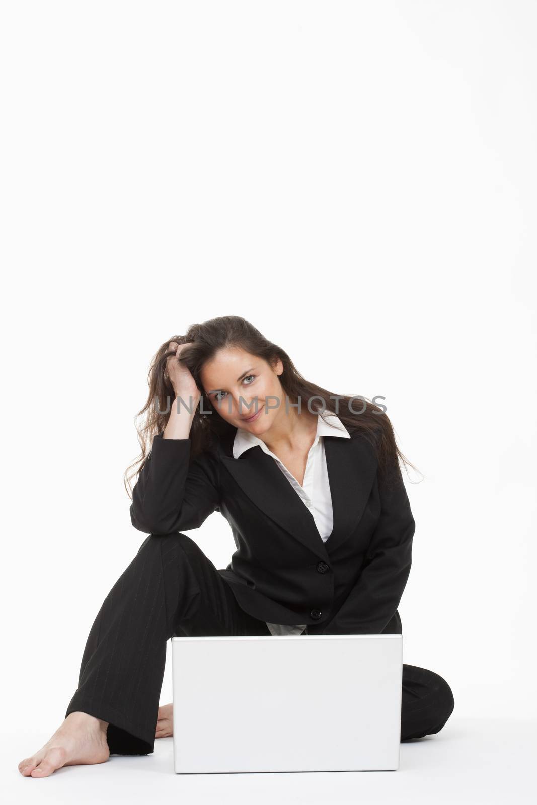 attractive young businesswoman working with laptop computer smiling