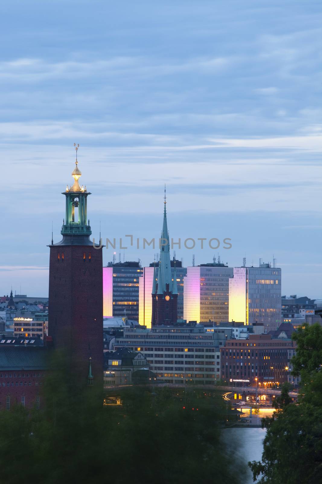 sweden stockholm - town hall and city highrises during long summer night