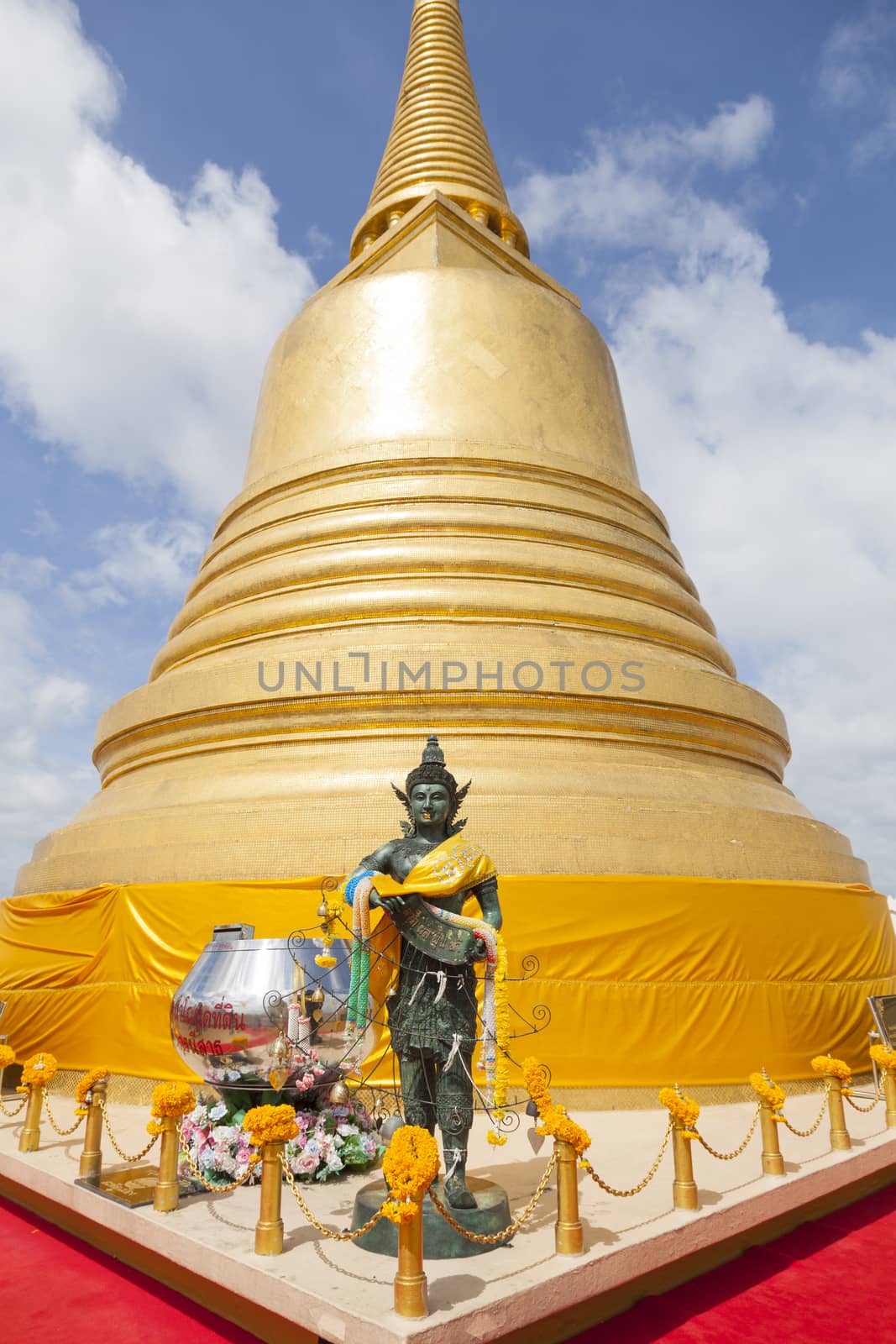 Golden stupa in fine weather and clear skies.
