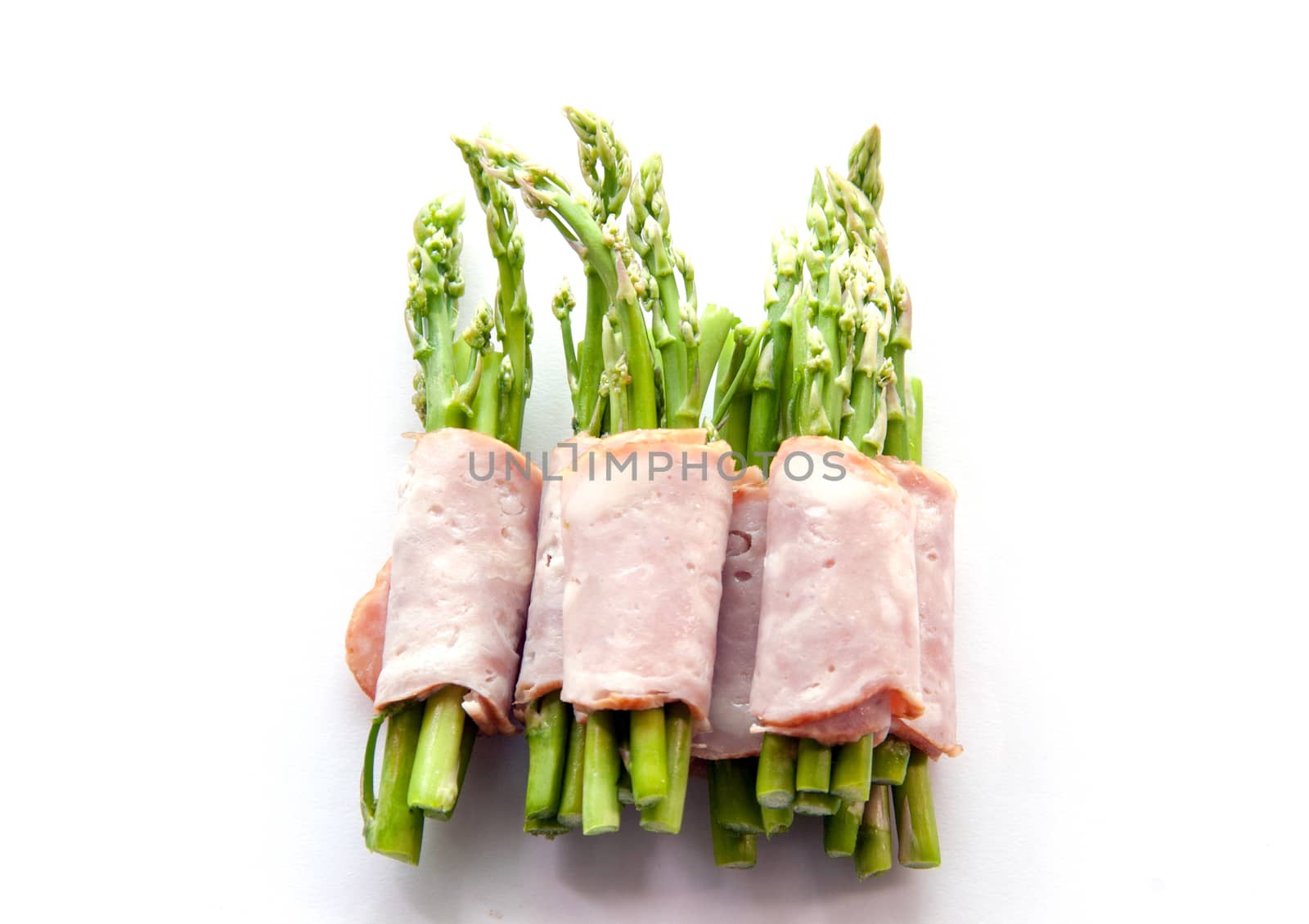 close up bacon wrapping asparagus on isolate