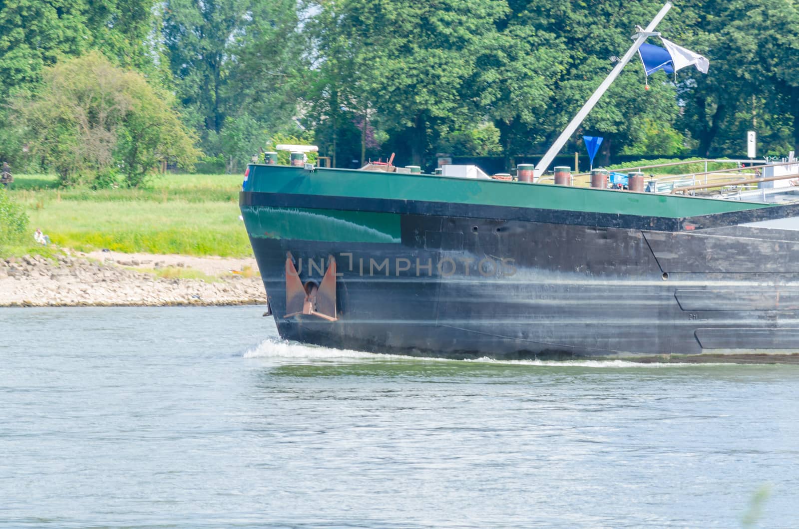 Barge with a bow wave by JFsPic