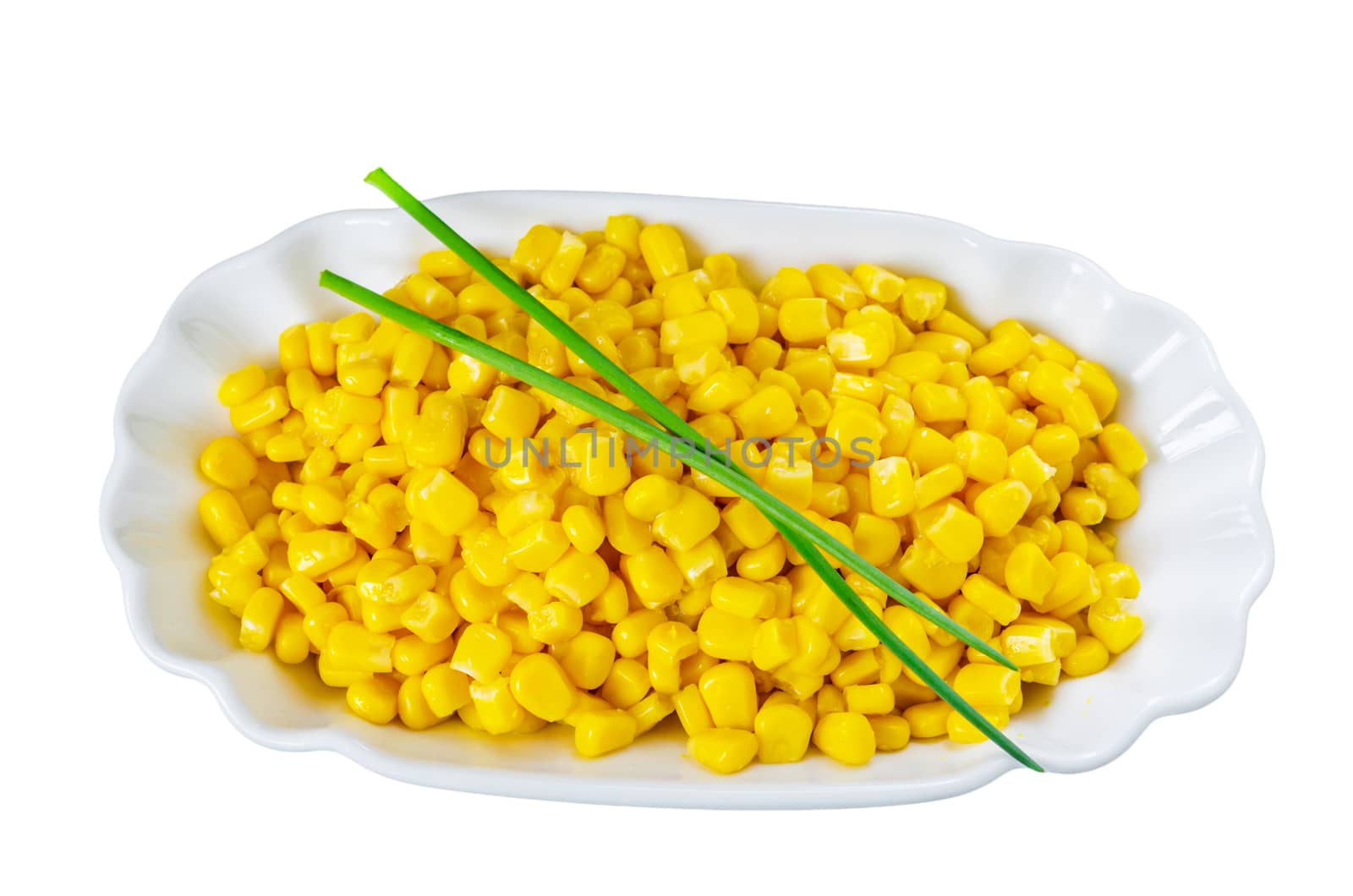 From a high angle close up of a small white ceramic bowl full of yellow corn grains. Isolated on white.