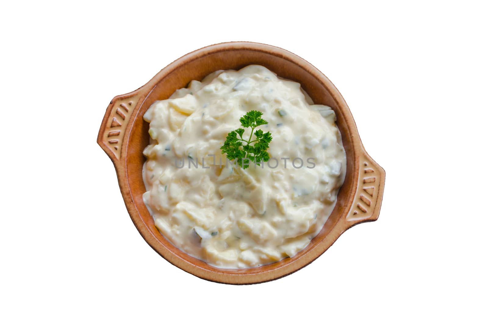 Top view of a little brown bowl with a serving of potato salad. Isolated on white 
details