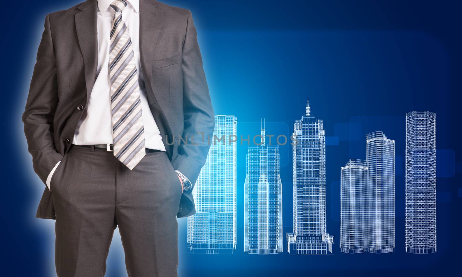 Businessman in suit standing and holds hands in pockets. Glowing wire-frame buildings as backdrop