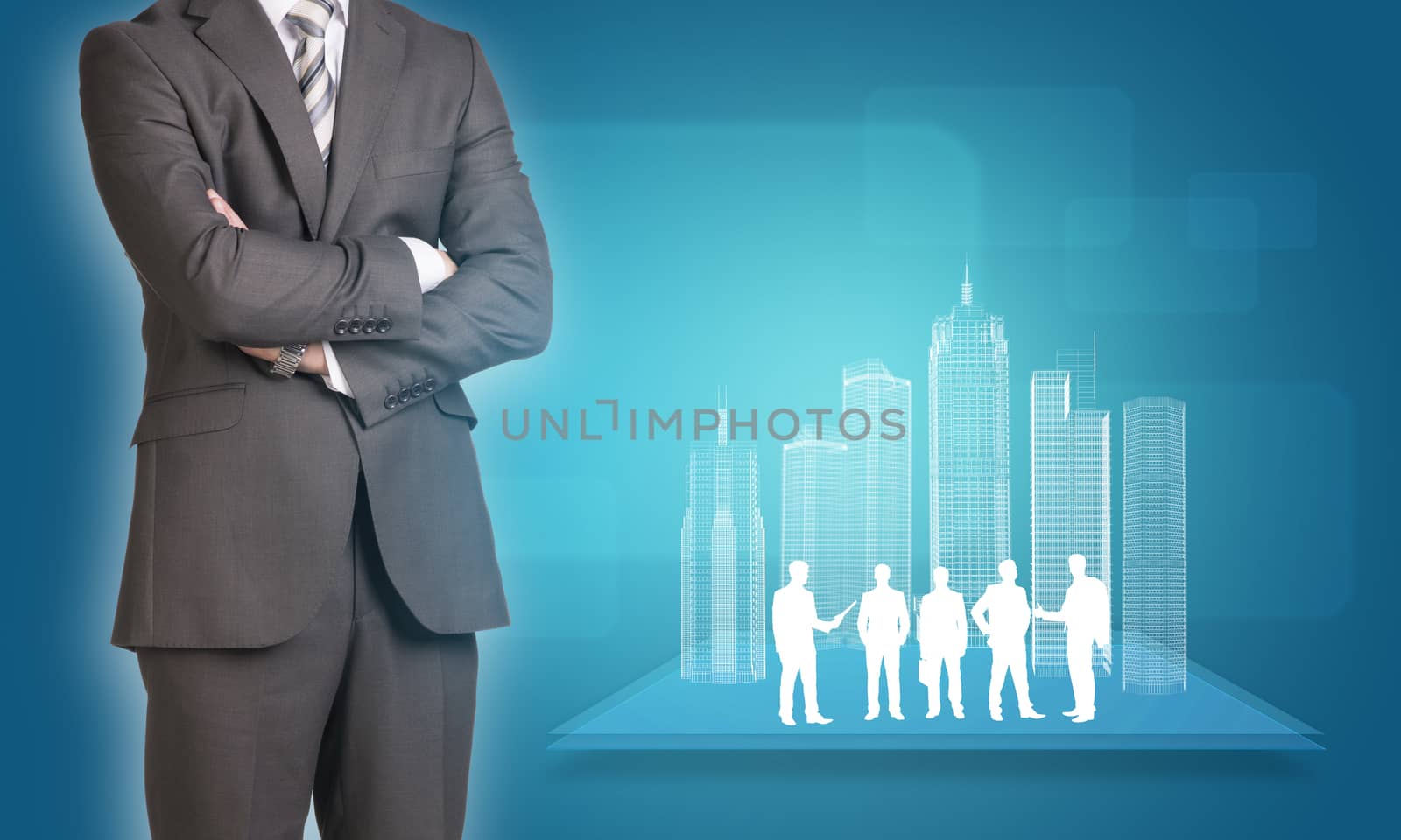 Businessman in suit stands with his arms crossed. Glowing wire-frame buildings and business silhouettes on plane as backdrop