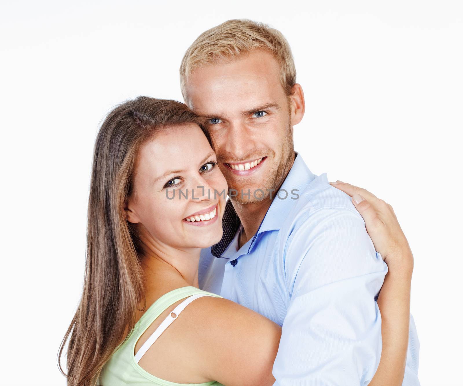 Portrait of a Happy Young Couple Smiling Looking - Isolated on White