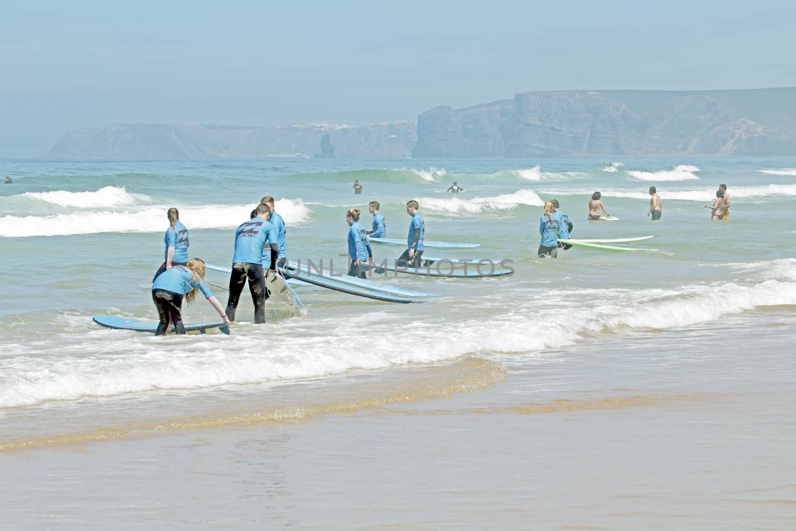 VALE FIGUEIRAS, PORTUGAL - August 20 2014:  Surfers getting surf classes on the famous surfers beach Vale Figueiras in Portugal