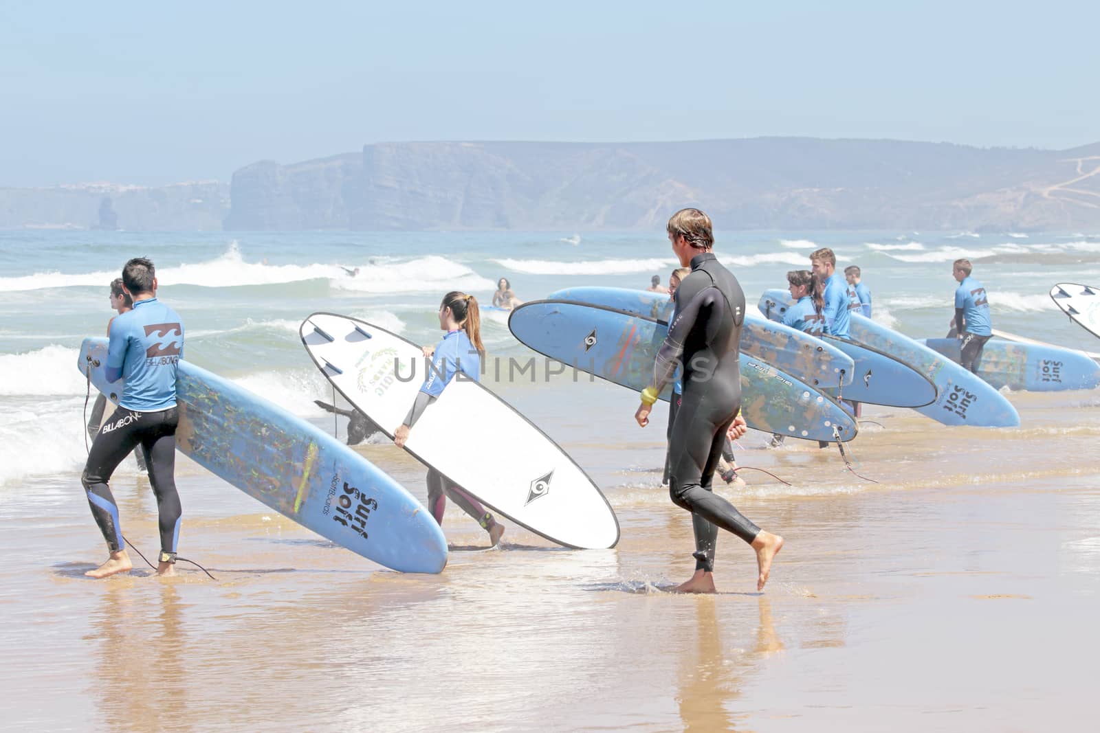 VALE FIGUEIRAS, PORTUGAL - August 20 2014:  Surfers getting surf classes on the famous surfers beach Vale Figueiras in Portugal