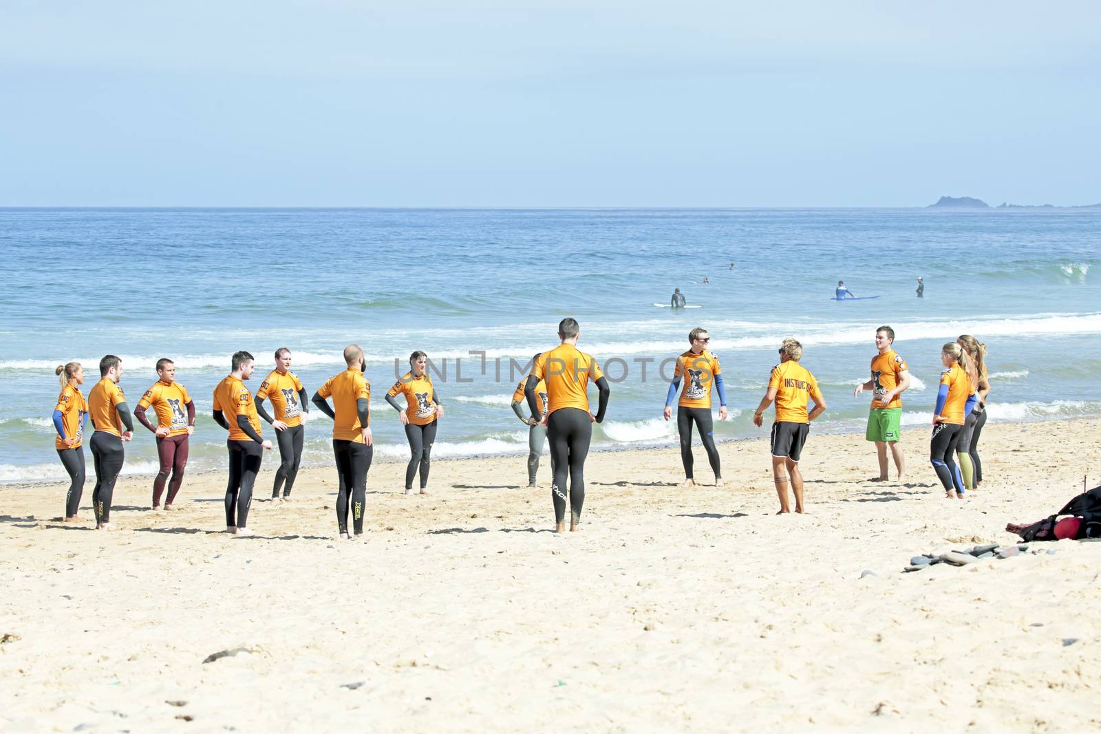 VALE FIGUEIRAS, PORTUGAL - August 22 2014:  Surfers doing excersises on the famous surfers beach Vale Figueiras in Portugal