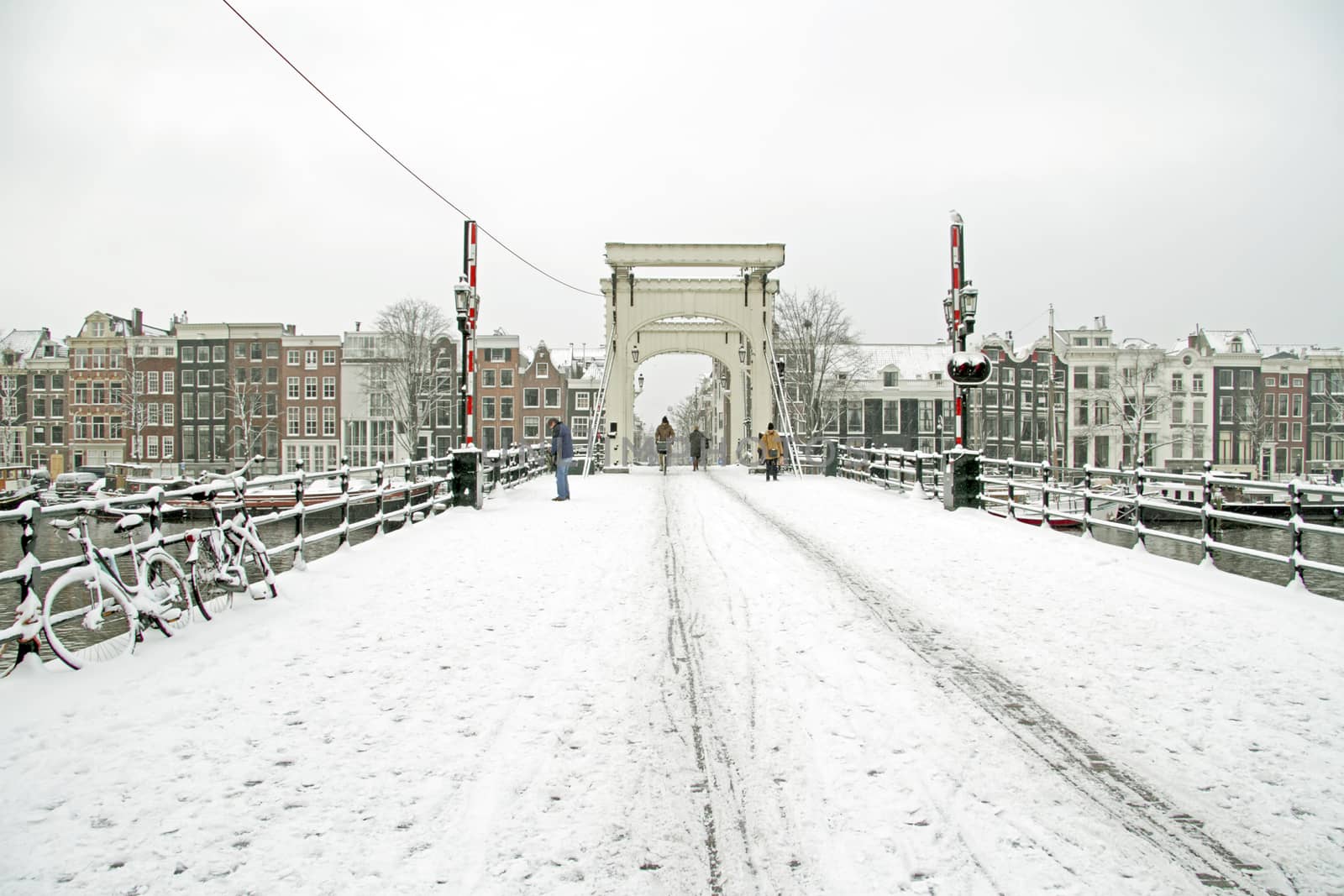 Snowy Amsterdam with the Thiny bridge in the Netherlands