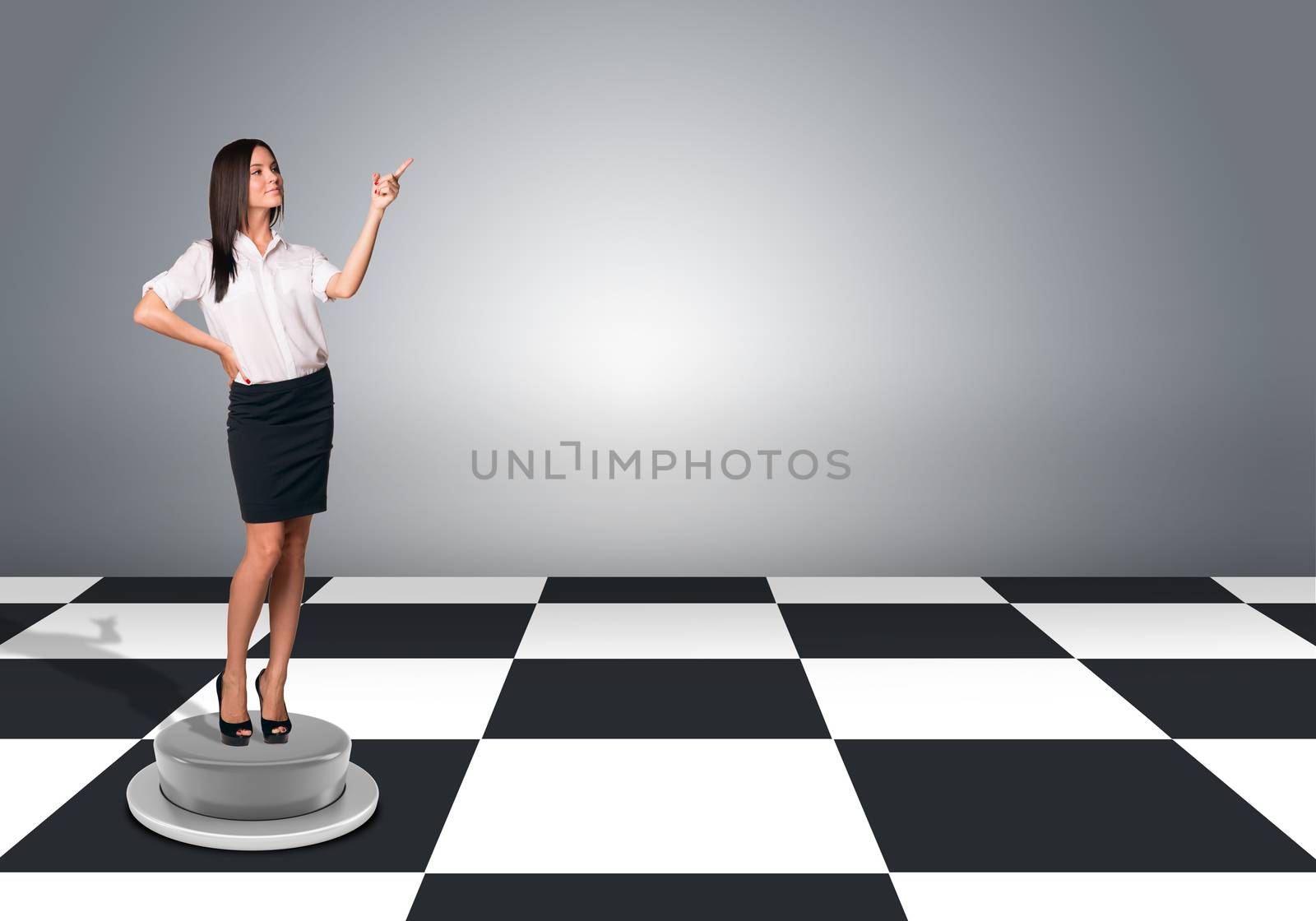 Beautiful businesswomen in blouse and skirt standing and pushing an imaginary buttons. Floor with checkerboard texture and gray wall