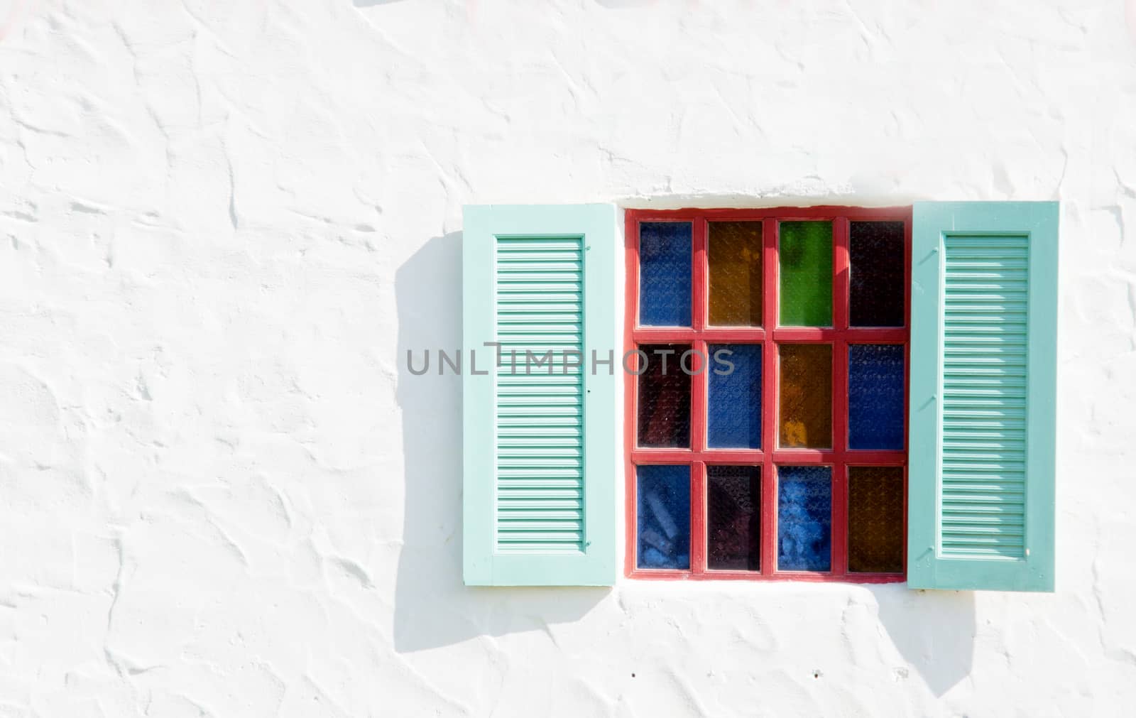 vintage open windows on white cement wall