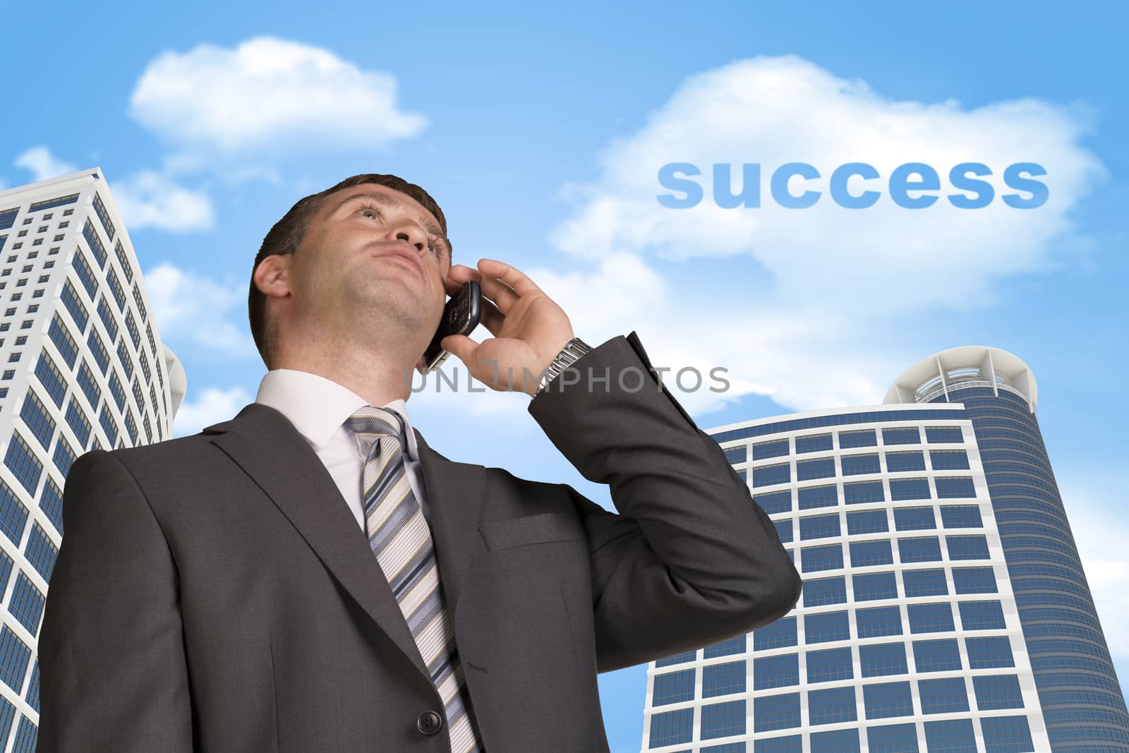 Businessman talking on the phone. Skyscrapers and cloud with word success in background
