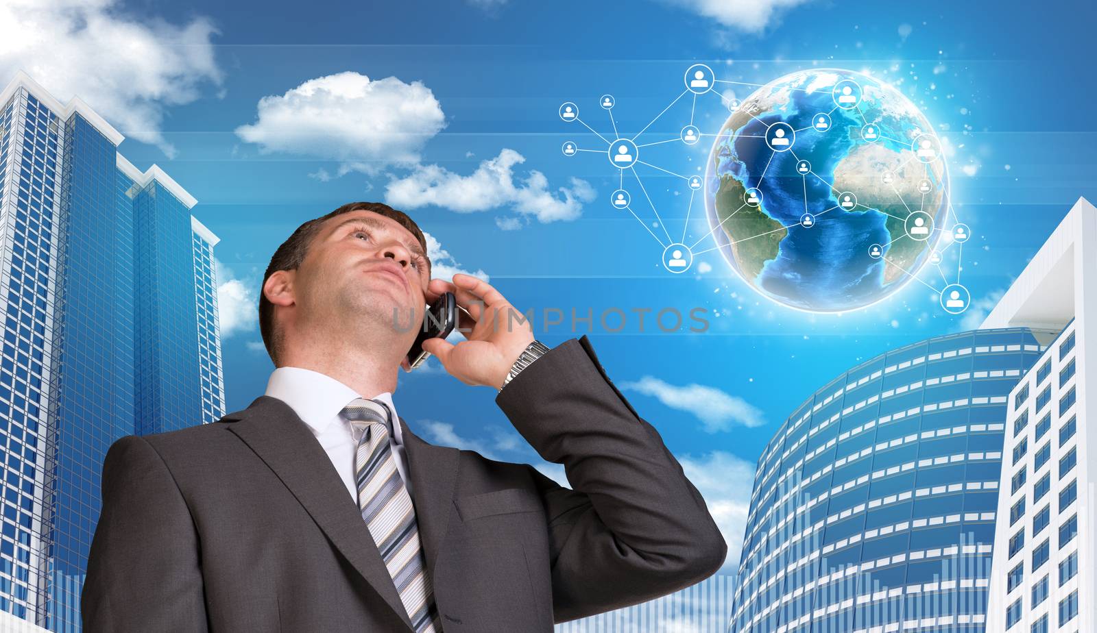 Businessman talking on the phone. Skyscrapers and Earth with network in background