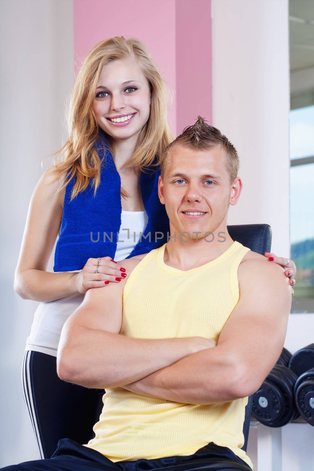 young couple in gym by courtyardpix