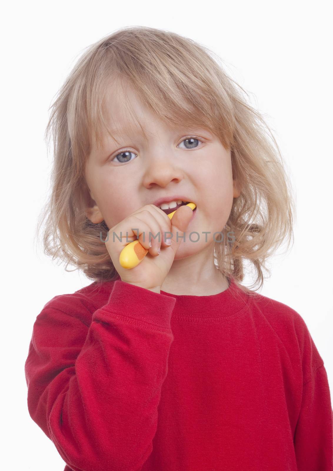 boy with long blond hair and toothbrush - isolated on white